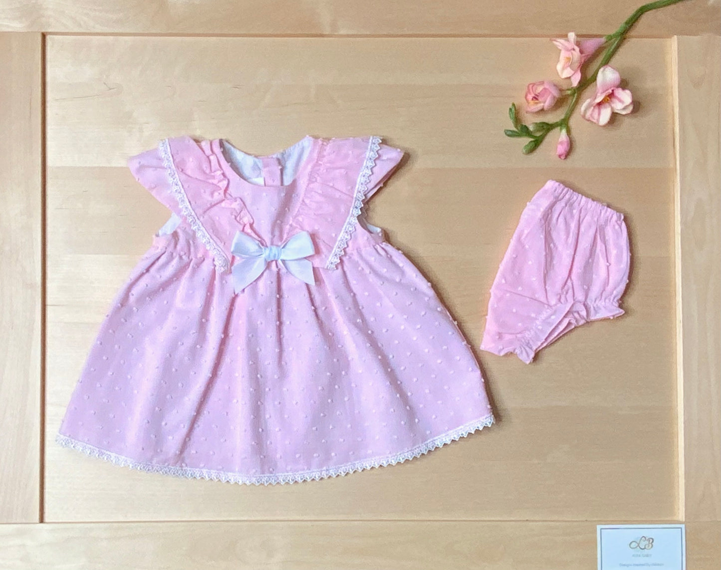 The Peony pink Swiss dot flutter sleeve dress and matching bloomers, front view-Alfa Baby Boutique 