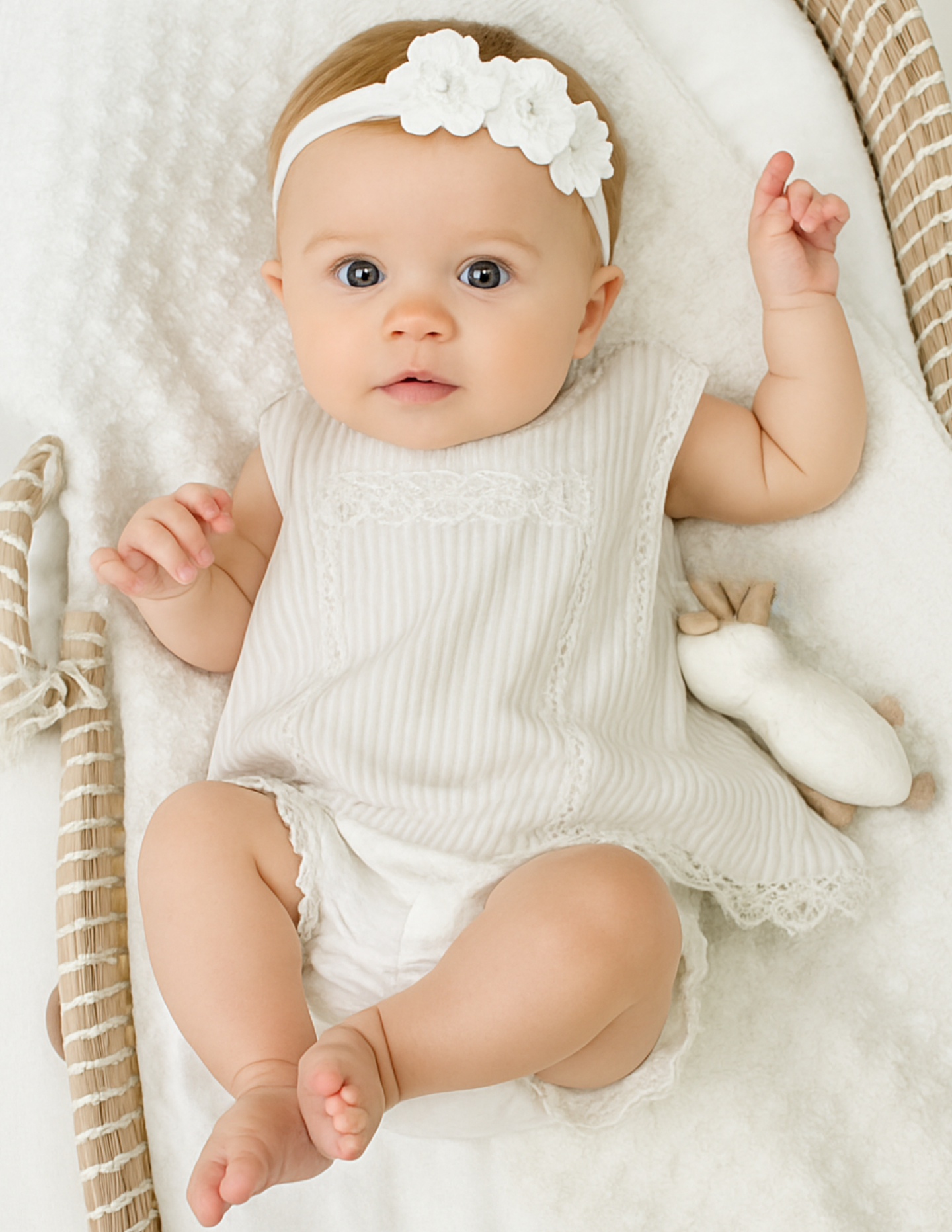 Baby girl wearing The Sweet Vanilla ivory A-line dress and bloomers set with white flower headband — Alfa Baby Boutique